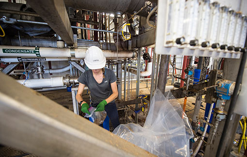 Researchers take samples from the Pilot Plant during a 48 hour Hot Test at the Integrated Biorefinery Research Facility at NREL.