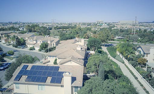 A picture of solar panels on rooftops.