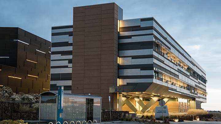 Outside view of the Energy Systems Integration Facility, a multi-story laboratory building.