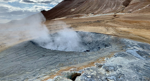 Geyser erupting from ground