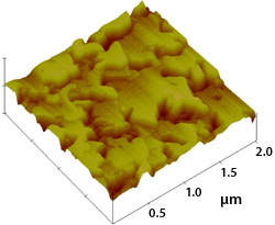 High-resolution, three-dimensional image of sample gallium phosphide on silicon device; the image was obtained using atomic force microscopy and features several densely packed yellow and red elevated areas that appear three-dimensional.
