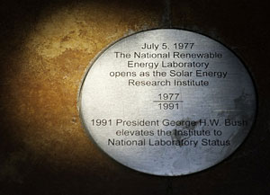 Photo of the sun hitting a medallion on the floor of a building at NREL.