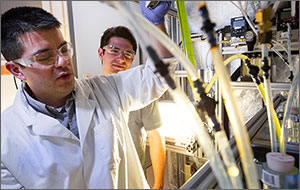 Photo of two men in a laboratory setting.