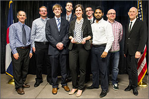 Photo of eight men and one woman, including the winning Montage Builders Northern Forest team.