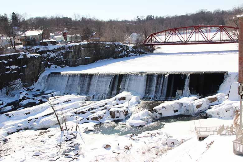 A snow-covered river dam