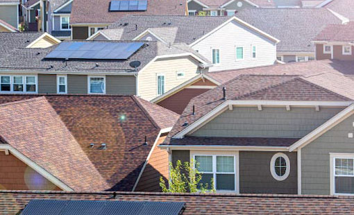 A neighborhood full of homes with rooftop solar panels.