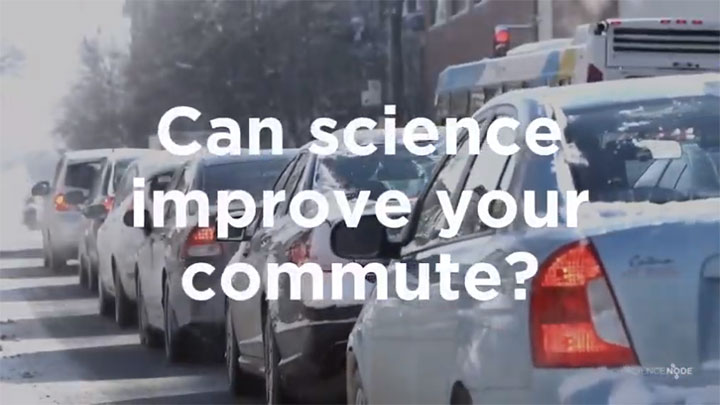 Vehicles drive in a line of traffic with a text overlay that says “Can science improve your commute?”