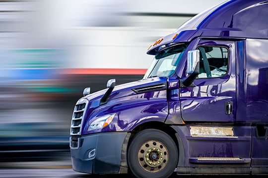 A purple semi-truck
