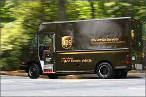 Photo of a UPS delivery van with the words "low emission hybrid electric vehicle" on its side.