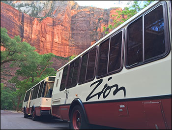 Photo of shuttle buses in mountain setting.