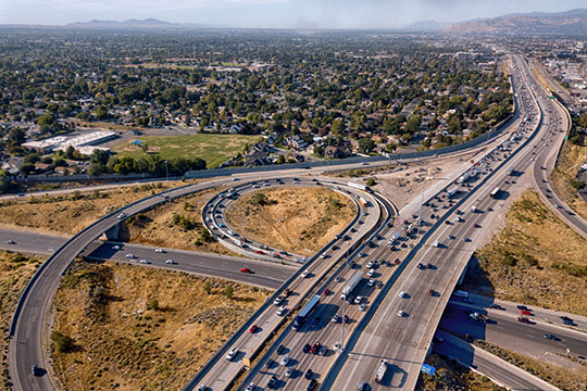 An aerial view of a highway in a suburb.