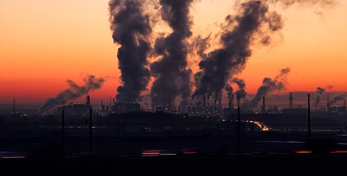 Smoke stacks at sunset.