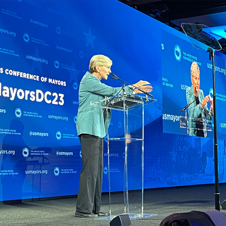 Secretary Granholm speaking at the US Conference of Mayors.