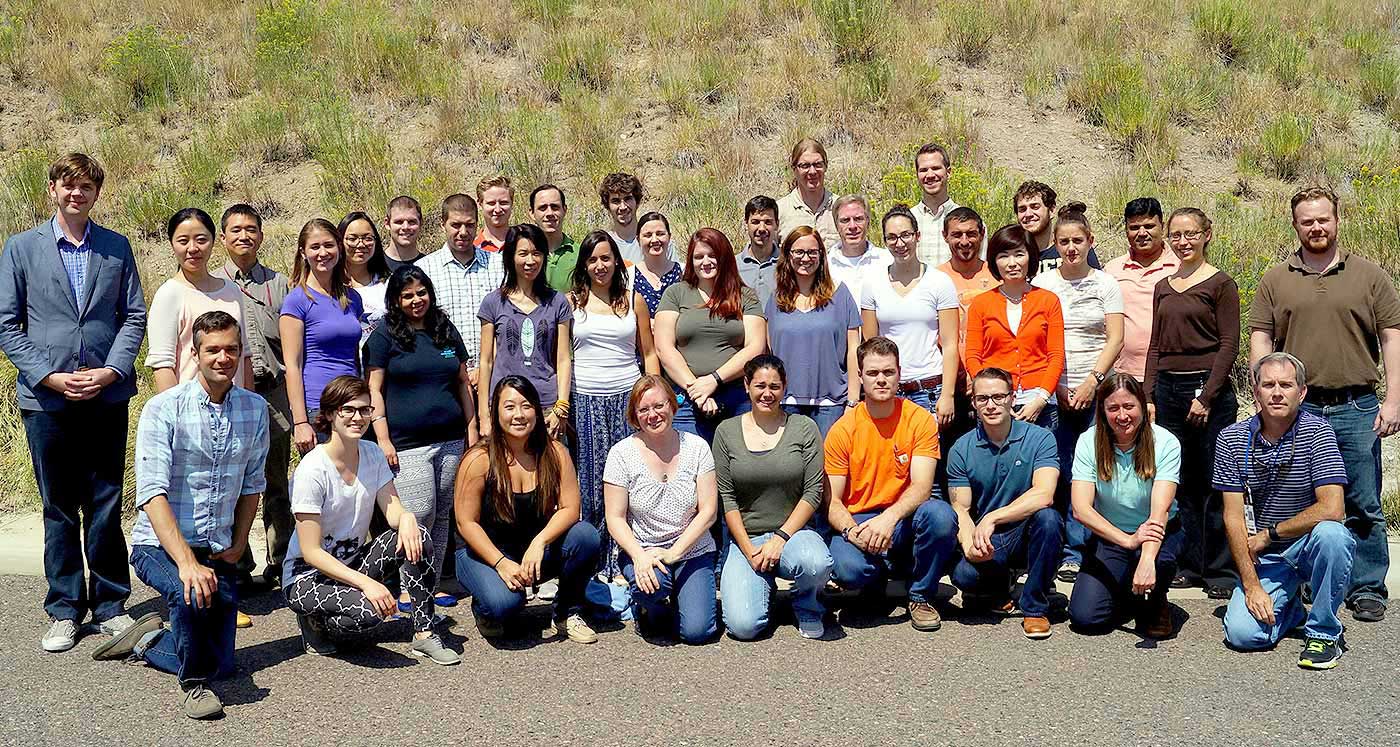 Group photo of a large number of people in an outdoor setting.