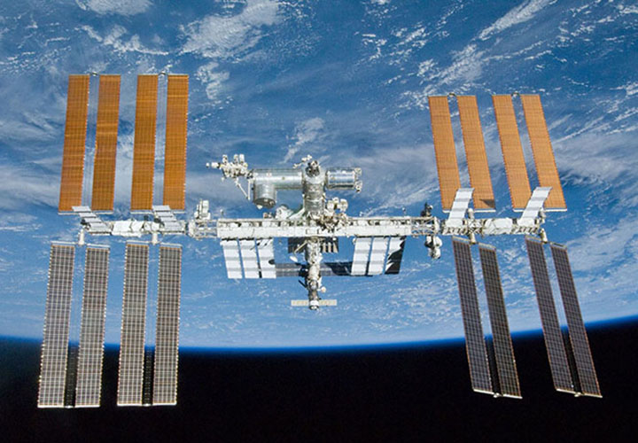The International Space Station in orbit above the Earth.