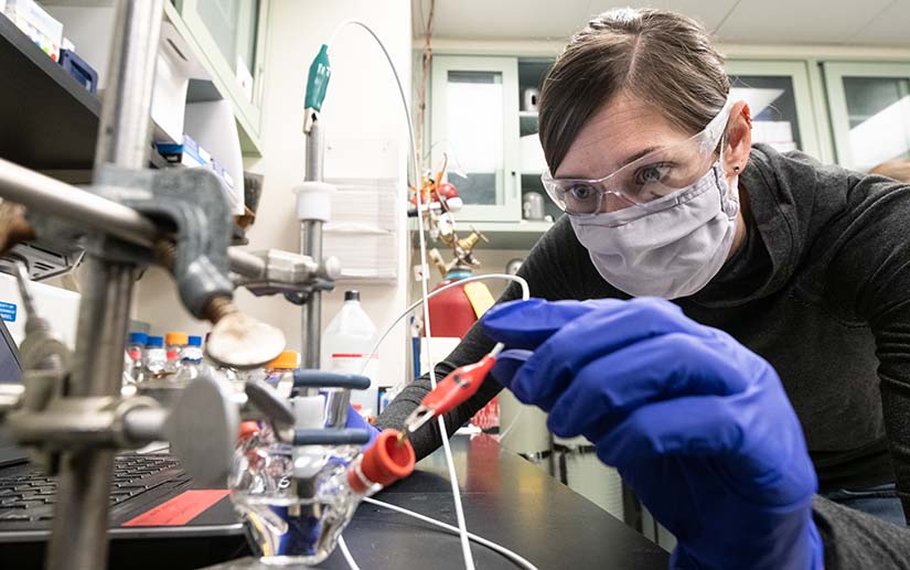  An NREL researcher assembles a 3-electrode electrochemical microcell for measuring the energetic properties of a unique class of energy-conserving enzymes in the bioenergy lab at the Field Test Laboratory Building