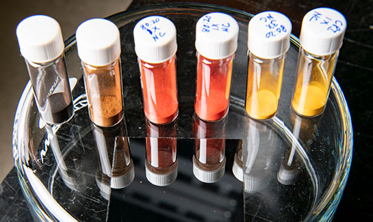 Six vials containing substances
