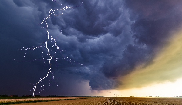 Lightning striking a field in a storm