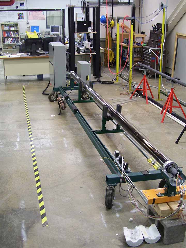 A metal stand within a large laboratory space.