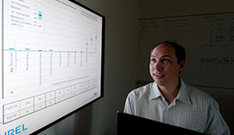 Researcher projects an analysis table to a large screen.