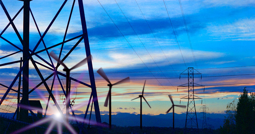 Photo illustration of transmission lines near a series of wind turbines.