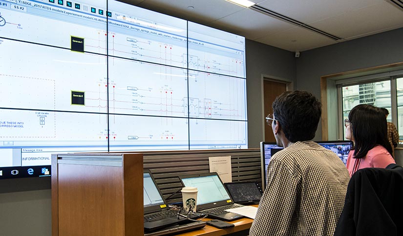 Researchers work in the Energy Systems Integration Facility Control Room