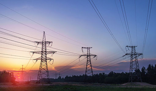 Electrical towers at sunset
