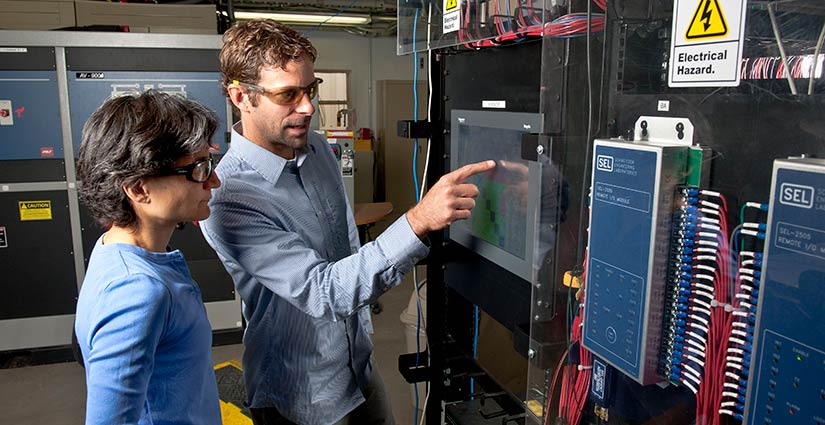 NREL engineers work on data capture for micro-grid synchronization wave forms.