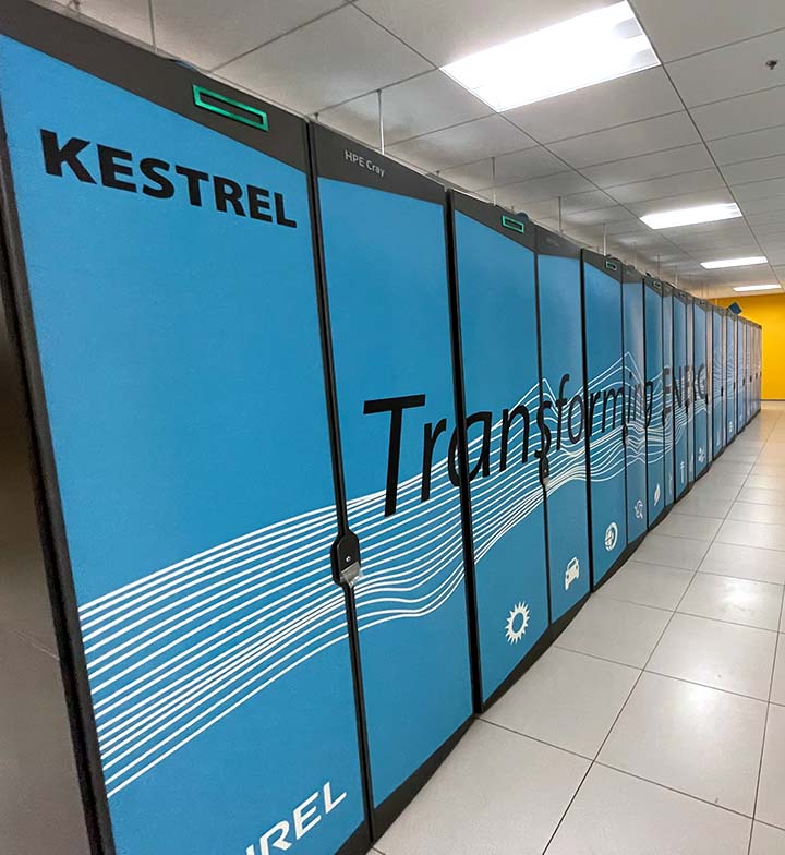 A row of computer cabinets with the word Kestrel written on them.