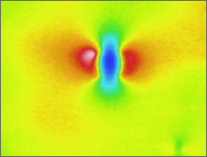 Thermal image with bright colors in center representing defect.