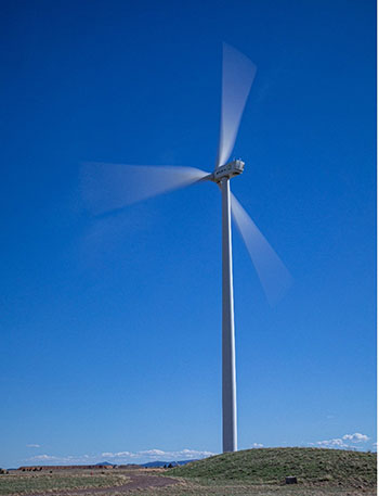 202404-newsletter-wind-turbine Wind turbine spinning on hill