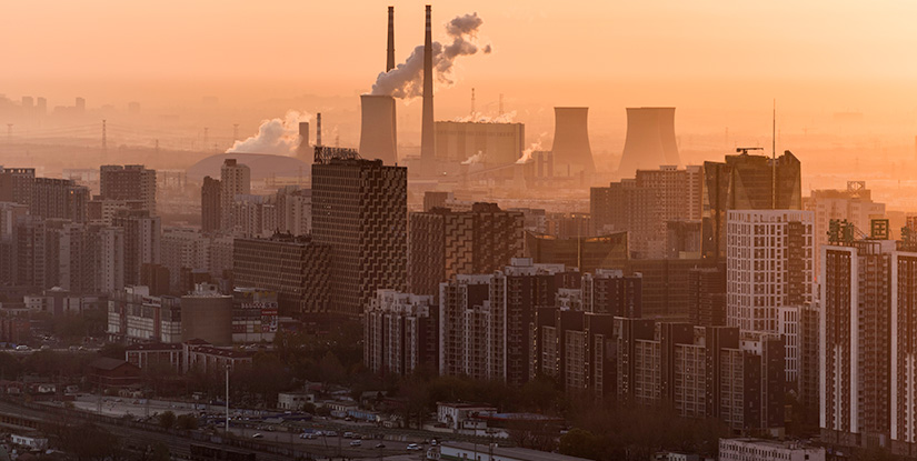 air-quality-getty Aerial shot of hazy city featuring smoke stack.