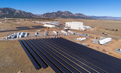 aries-73089-block Aerial view of Flatirons campus with solar panels and storage facility