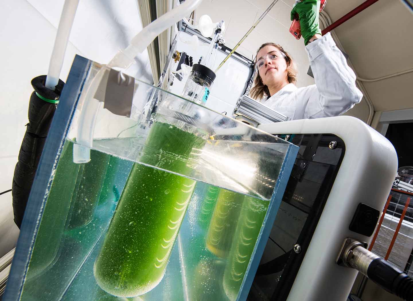 one researcher working on equipment in a lab