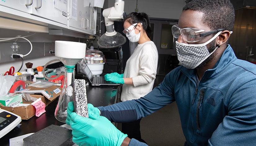 63295 NREL building researchers work in a lab.