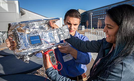 Two researchers work together.