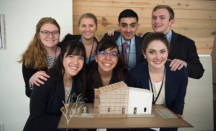 sd-race-to-zero-2018 Finalist team posing with their model at the 2018 U.S. Department of Energy Race to Zero Student Design Competition.
