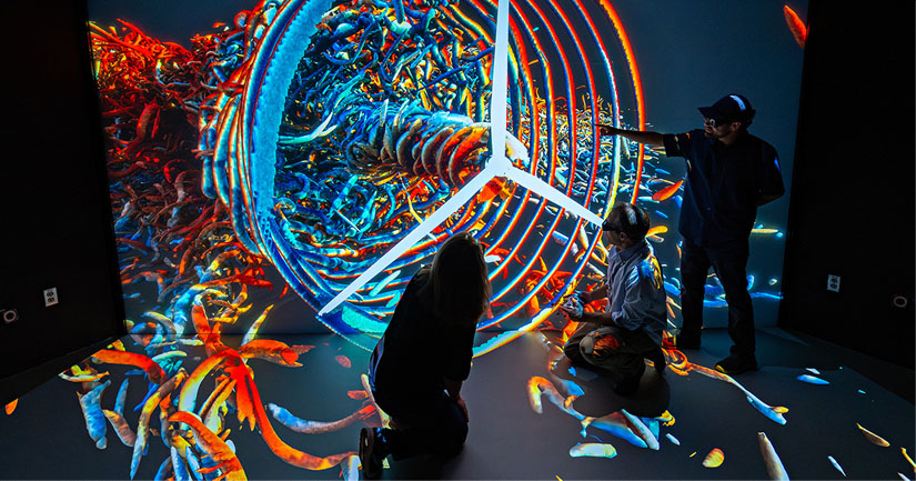 20240930-newsletter-turbine People standing in front of large display screen showing a 3D image of a spinning turbine
