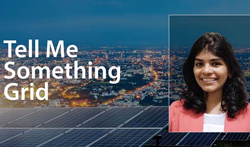 Continue reading about Solar panels in the forefront of city lights overlain by &quot;Tell Me Something Grid&quot; and a headshot of Sherin Ann Abraham.