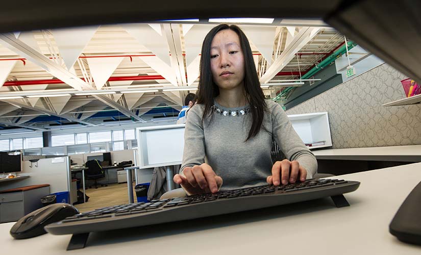 state-estimation-forecasting-36748 An NREL Post-Doctorate researcher works on grid analysis.