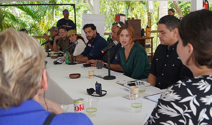 A group of people sitting at a table during an interview.