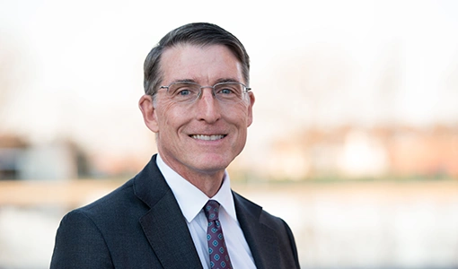 Portrait photo of a man in a suit and tie