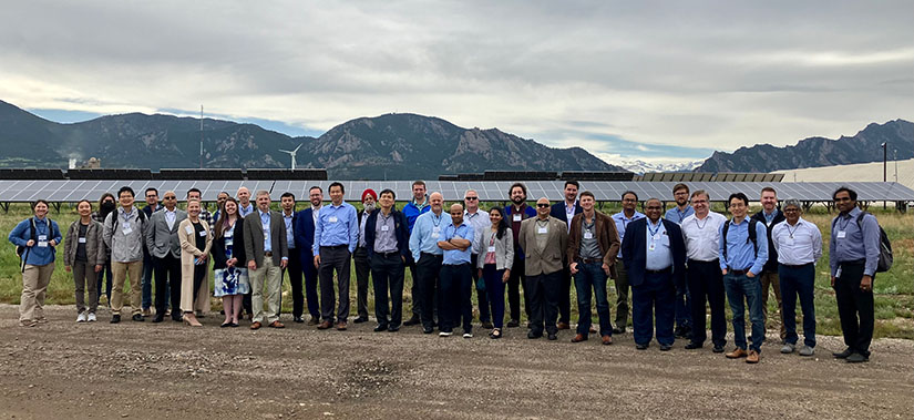 A gathering of researchers in front of renewable energy resources. A diagram of a power electronics research platform. Researchers viewing a live demonstration of power stability analysis.