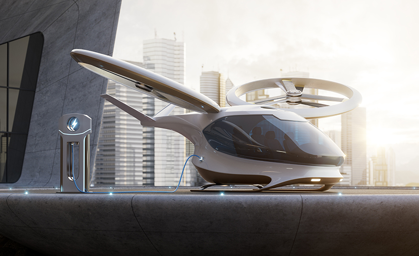 A rendering of a helicopter-type aircraft plugged into a battery charger.