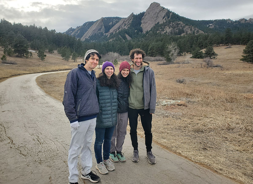 20250527-beneath-the-surface-why-bri-friedman-embraces-failure-group Four people stand on a hiking trail.