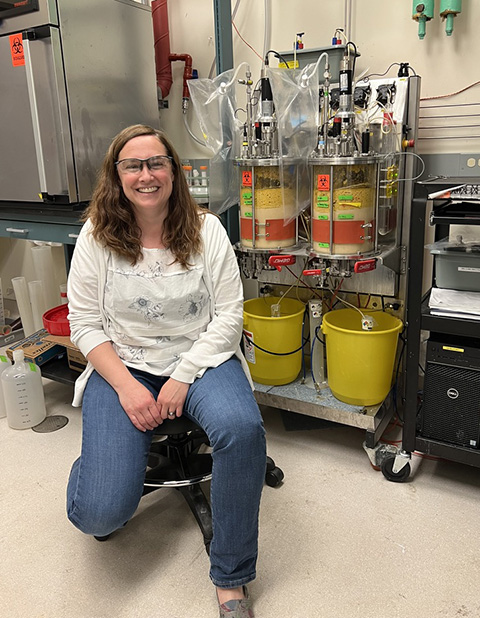 20250703-researcher-spotlight-violeta-sanchez-i-nogue-journey-bioprocess-development-nrel-lab A person sitting in a chair in a lab, smiling.