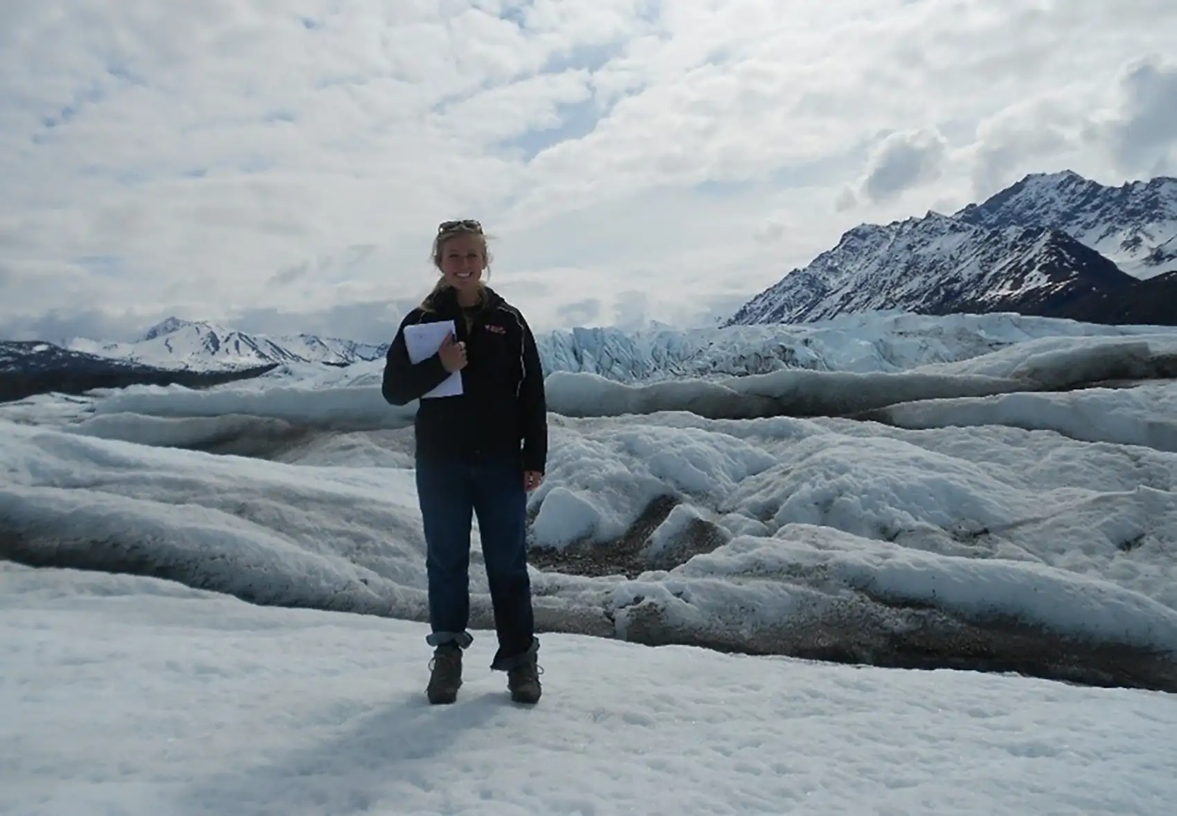 20250915-q-a-alli-werner-engineer-enlists-tiniest-engineers-microbes-recycle-plastics-mine-metals-more-alaska Alli Werner standing on a glacier