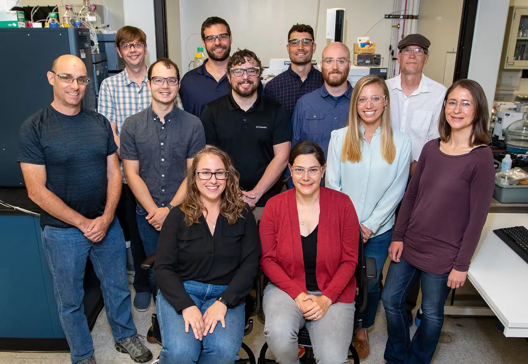 A group of researchers pose in a lab.