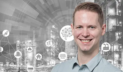 Headshot of Paul Meyer in front of a manufacturing graphic.