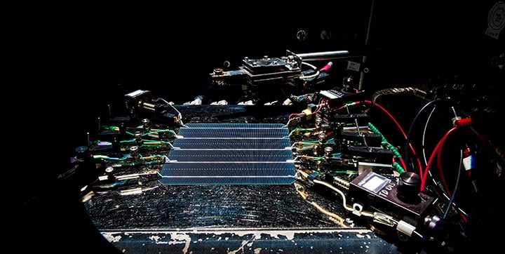 hp-48890 Five-busbar industrial c-Si wafer cell undergoing Kelvin probe measurement of short circuit current.